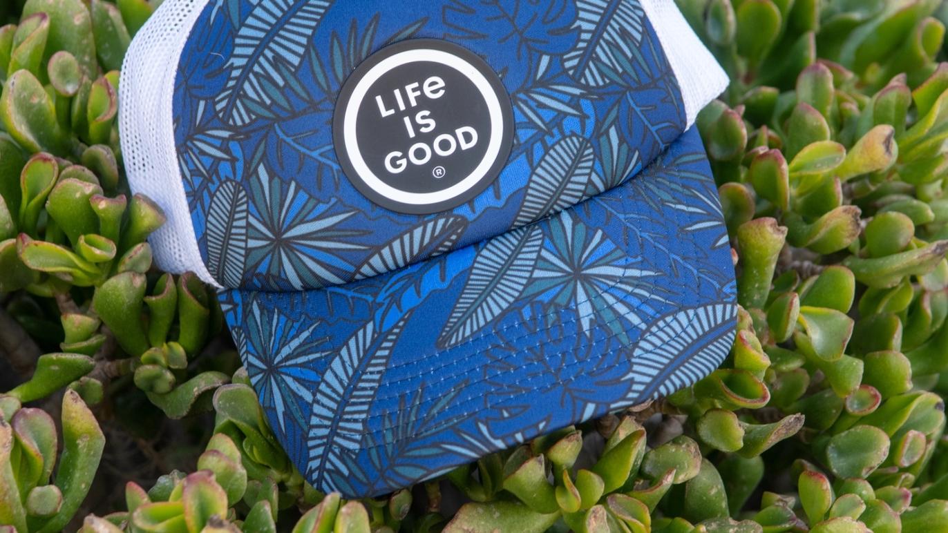 Life is good Cap on green foliage